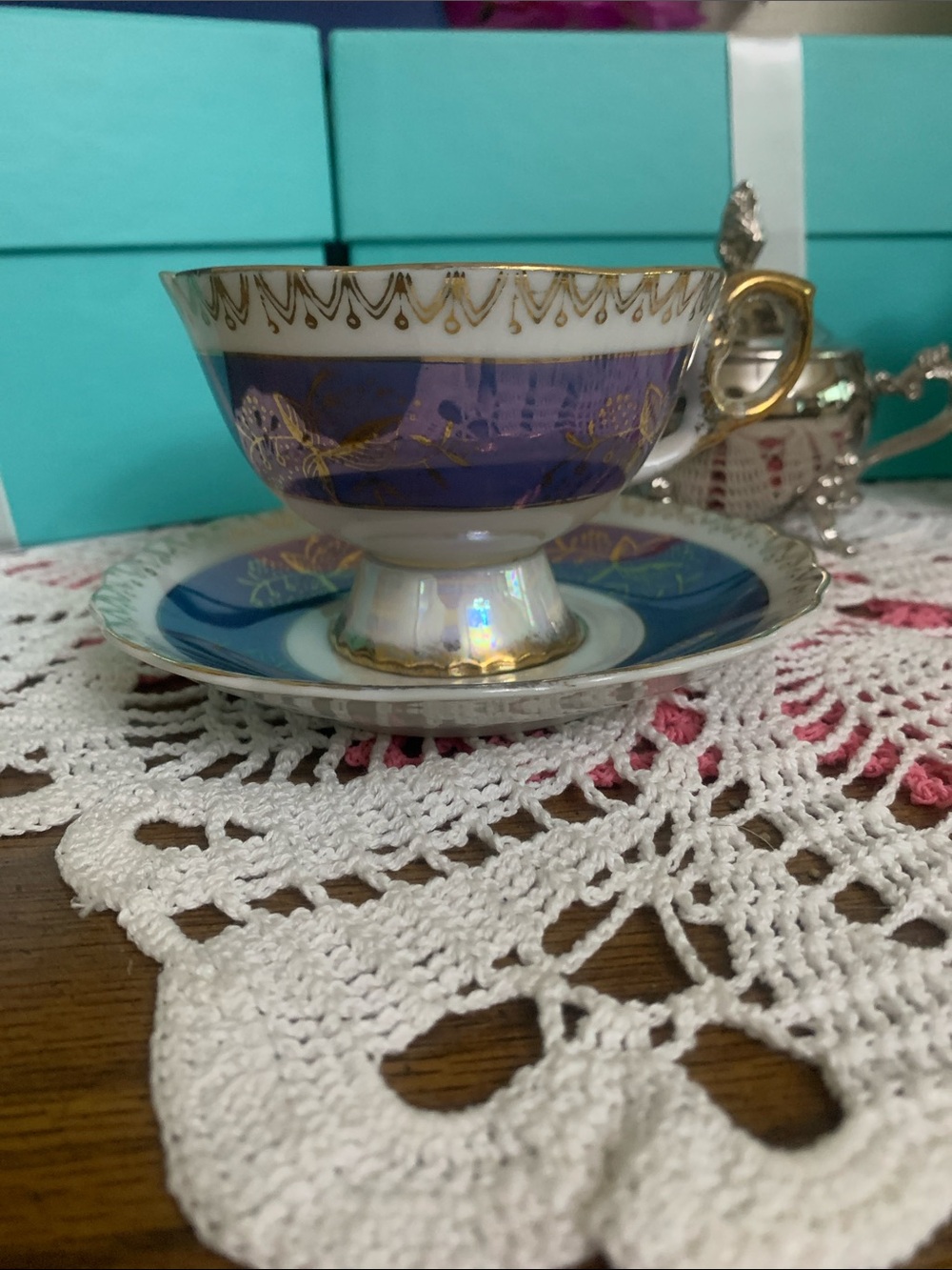 Elegant Blue and Gold Porcelain Teacup and Saucer